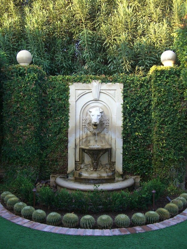 Formal Traditional Garden with stone fountain and Barrel Cactus