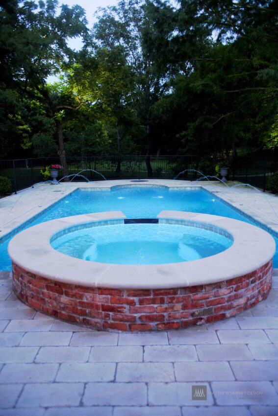 limestone coping and reclaimed brick pool and spa