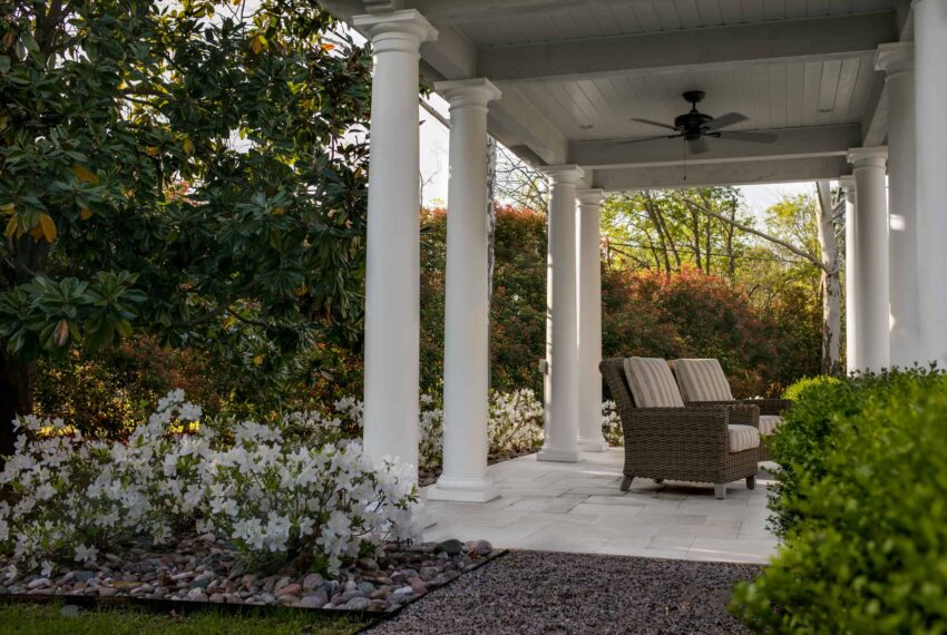 White Azaleas soften the edges of the covered pavilion's limestone floor.